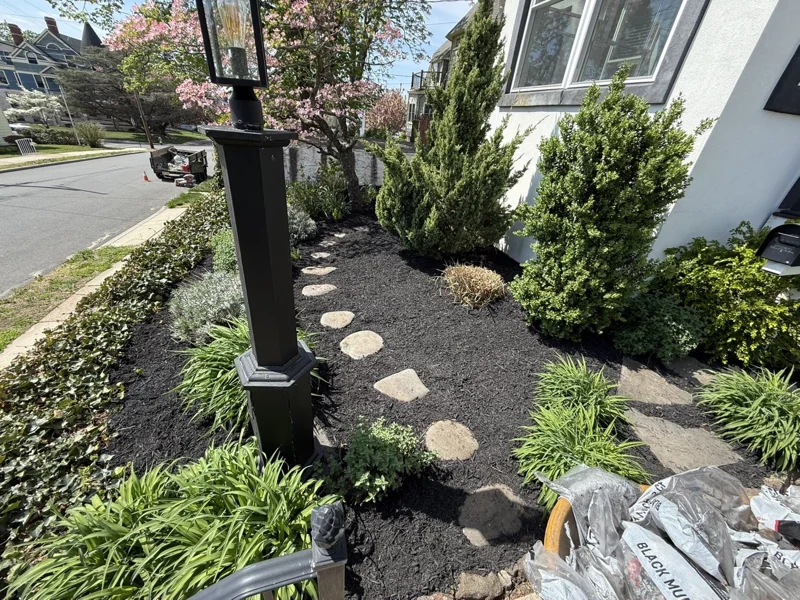 Stepping stones and plantings in a front garden bed
