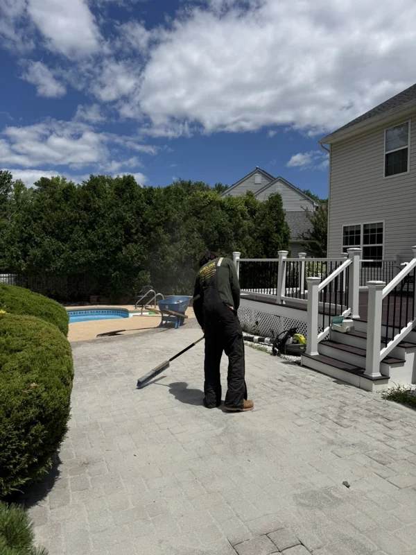 TrueLine crew member working on a backyard patio